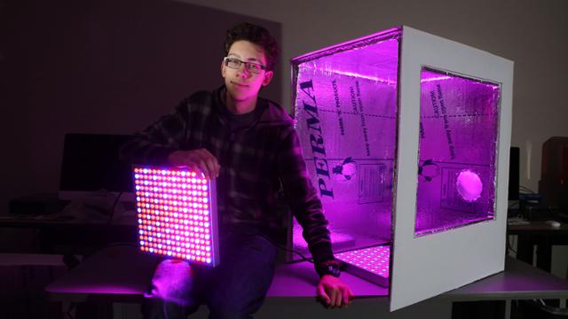 Ben Carpenter poses in front of his food computer prototype model