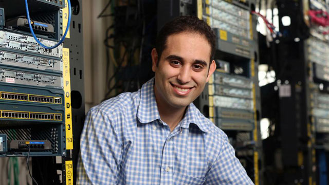 Jonathan Gavra sitting with computer servers