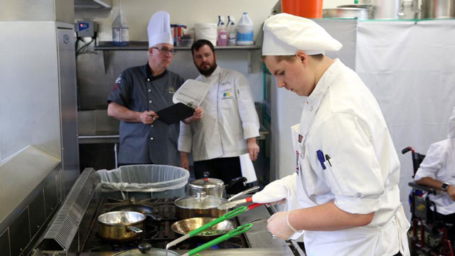 Students prepare a meal in the culinary lab