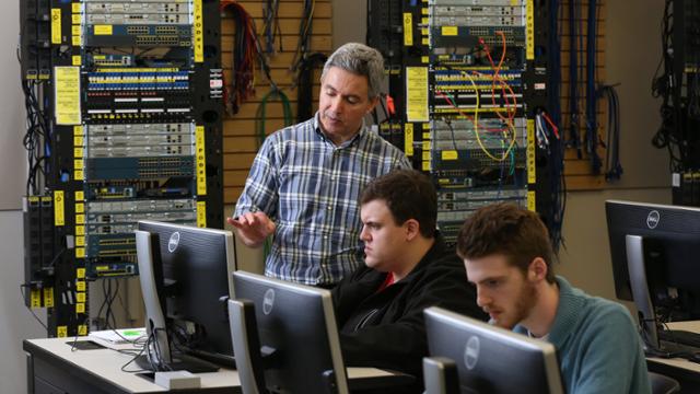 Professor Mazen Akkam teaching a networking class
