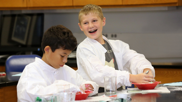 Two young boys having fun with arts and crafts