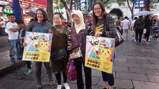 Beth Gulley with fellow protesters at a train station in China