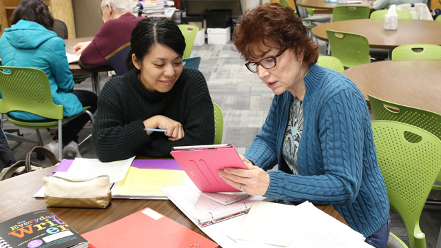 Tutor helping a student in the Writing Center