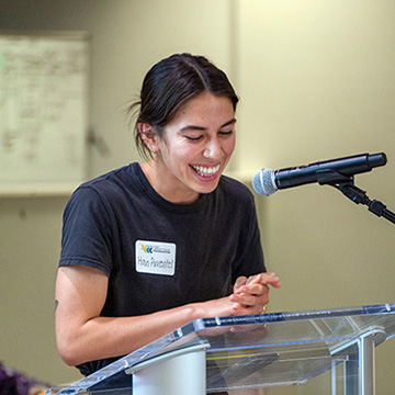 Han Pimentel smiles as she gives a speech at the Summer Sips and Scholarships event