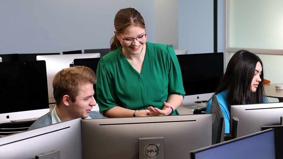 three students working in a computer lab on the JCCC campus