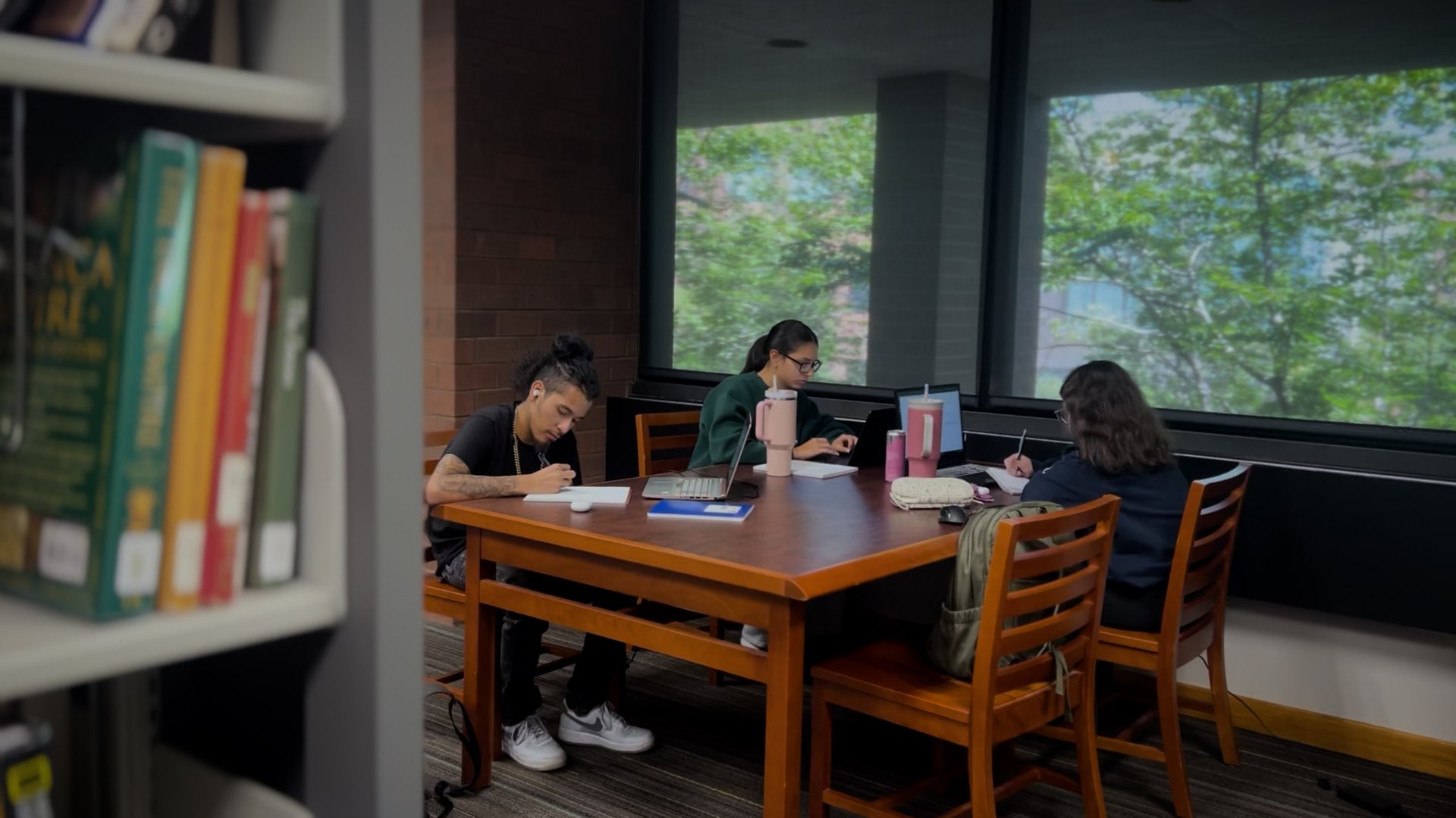 Student studying at a table in the Billington Library