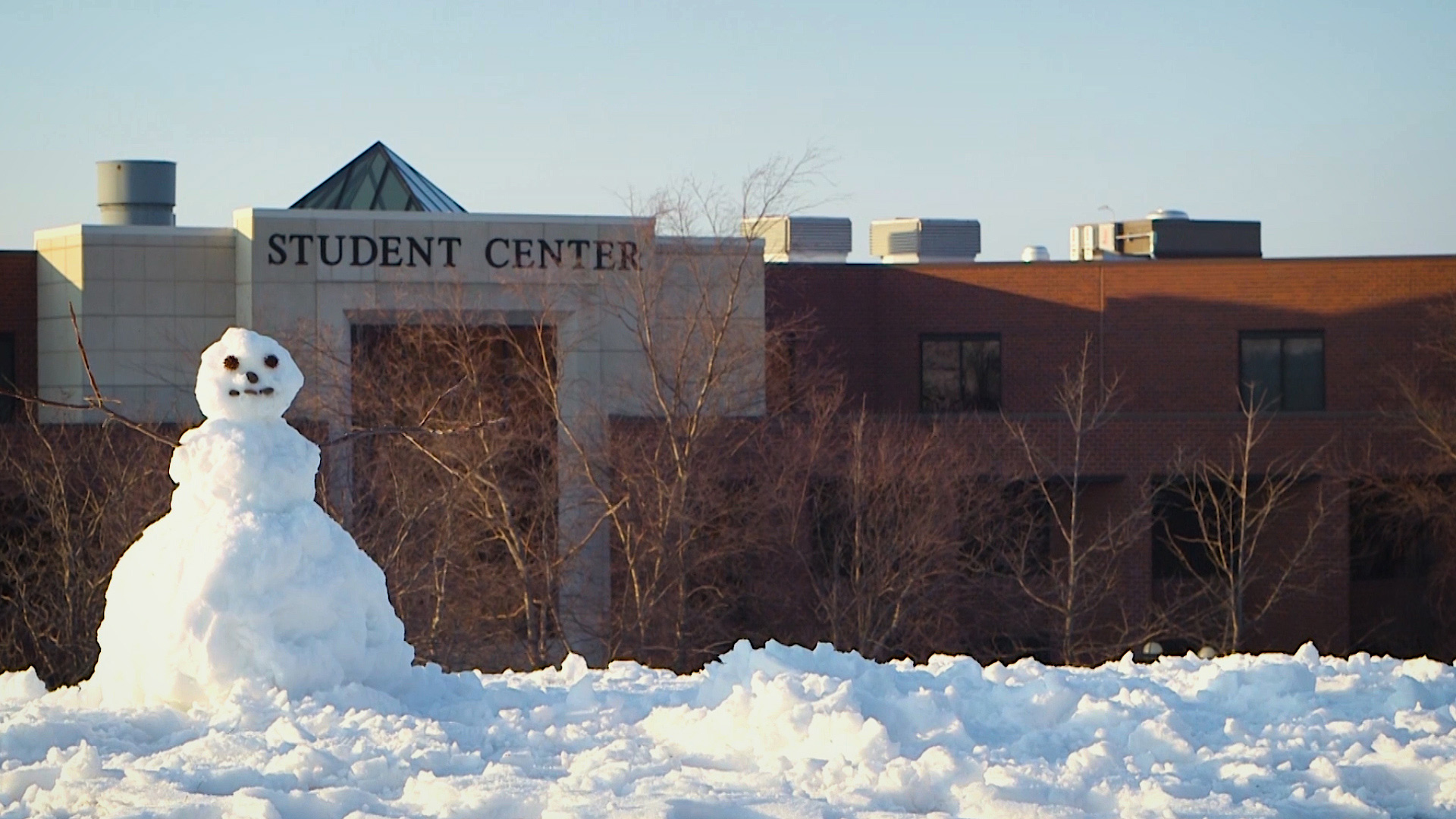 Front of the Student Center with a snowman in the foreground