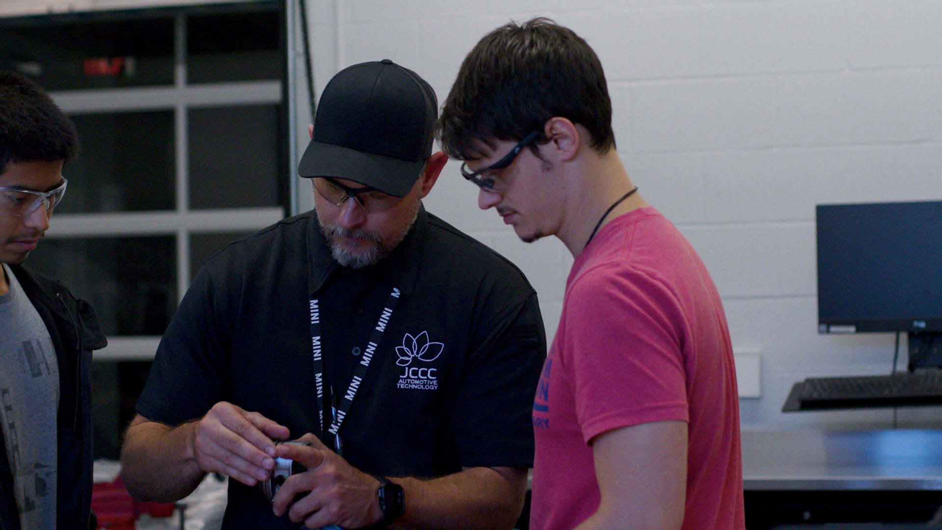 An instructor and student in the automotive lab