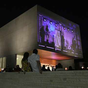 Every summer JCCC hosts Light Up the Lawn, and outdoor concert series. The performances are projected on the wall of the Nerman Museum of Contemporary Art.