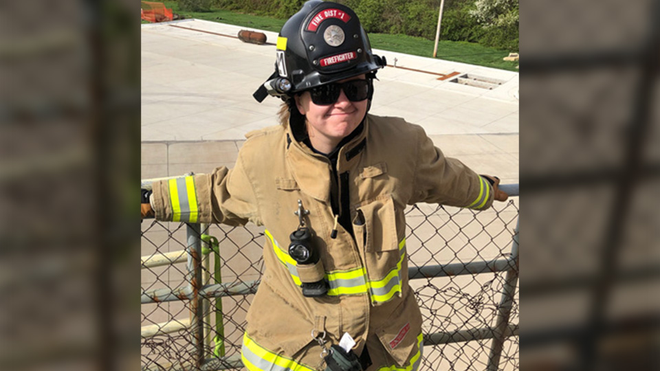 a fire science student wearing firefighting gear