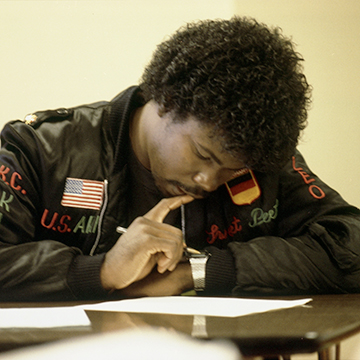 A student studies at a table at JCCC.
