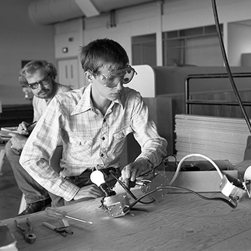 A student works on an electronics project.