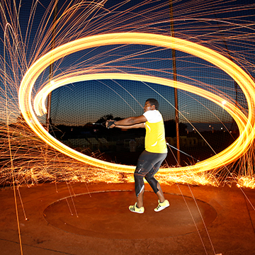 A hammer thrower winds up for a throw.
