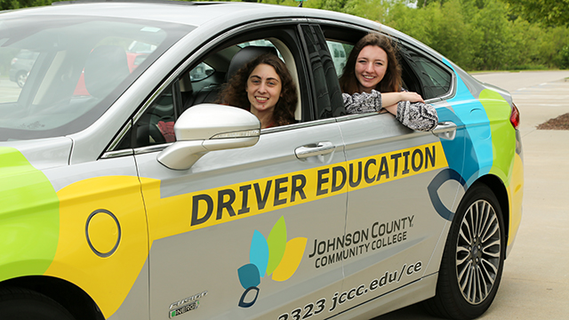 Two female high school students in a JCCC Driver Education car