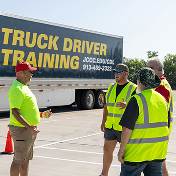 cdl students talking with an instructor