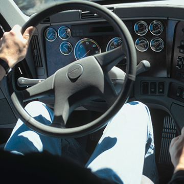 The steering wheel in a semi truck.