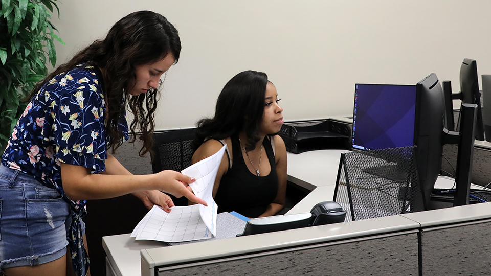 Students working together in a simulated office setting