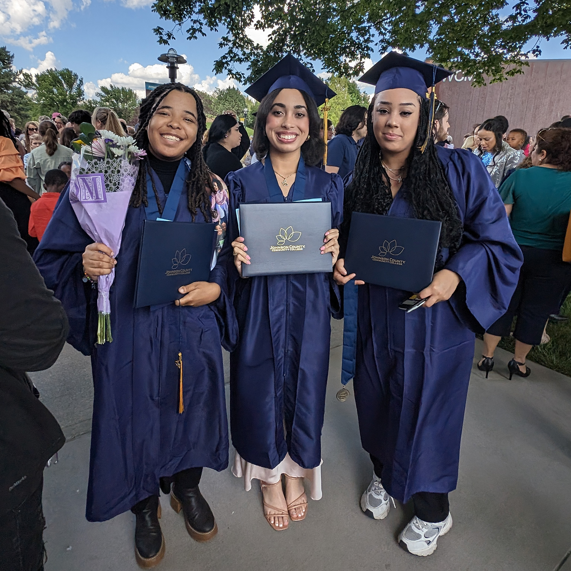 JCCC students wearing caps and gowns at graduation