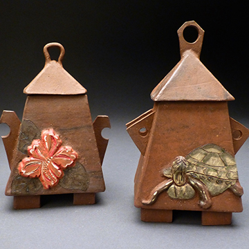 Ceramic art shaped like birdhouses