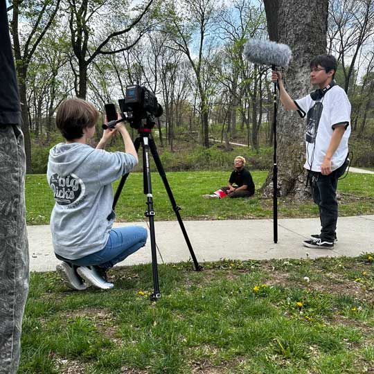 Students on set, shooting a film