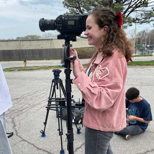 Student operating Black Magic Ursa and directing a film.