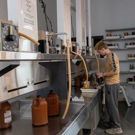 Student developing negatives in the analog photography studio