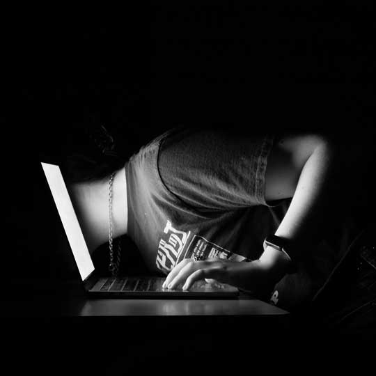 Silver gelatin photo of student putting their head in a computer