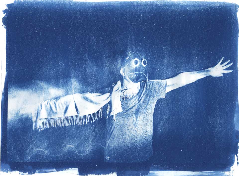 Cyanotype of woman with arms outstretched in death mask created for Independent Study