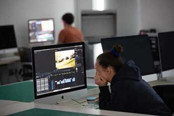 Students in the film and media studies studio