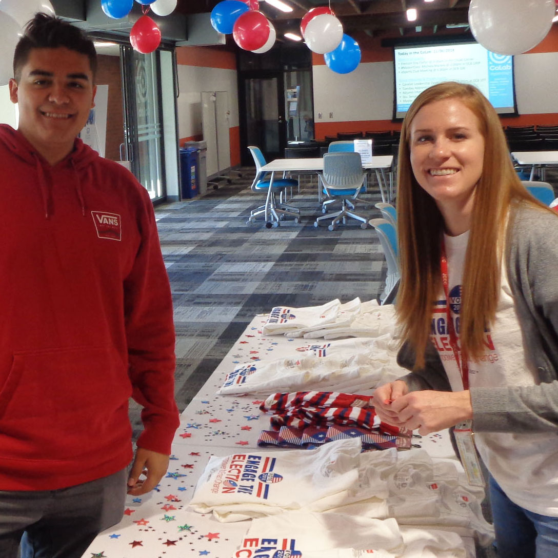 Tara Karaim, Community-Based Learning coordinator, and Abe S. participate in an election day party as part of the Crush the Vote initiative.