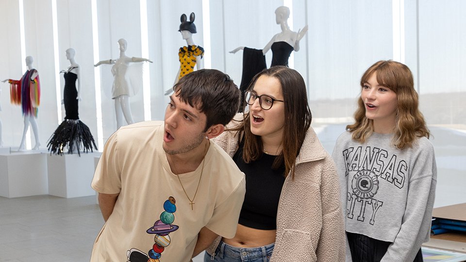 Students react with wonder watching at art installation in progress