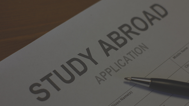 Study abroad application with a pen