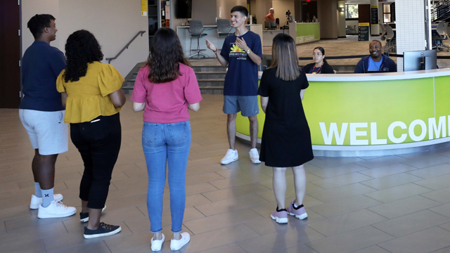 Students at the Welcome Desk as the prepare for a campus tour