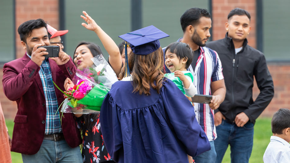 Family of international student celebrating graduation