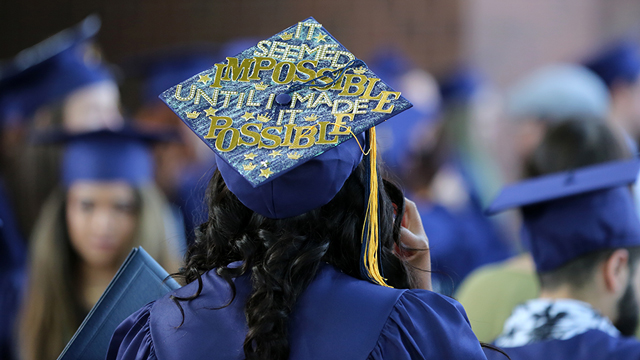 Decorated graduation cap that says, "It seemed impossible until I made it possible"