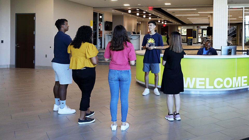 Future JCCC students begin their campus tour at the Welcome Desk in the Student Center.