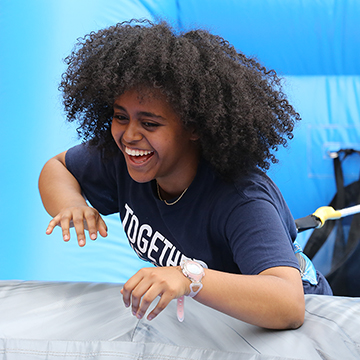 A student enjoys one of the games during the annual end-of-year Campus Craze celebration.