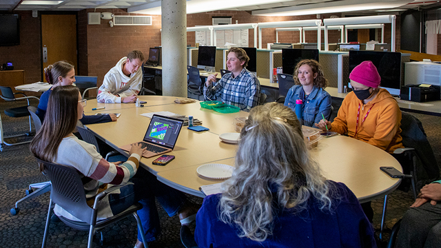 Student editorial team for the Campus Ledger having a meeting