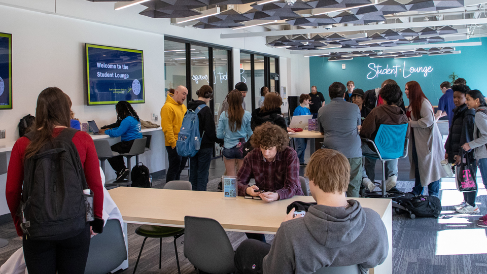 Students playing air hockey in the Student Lounge