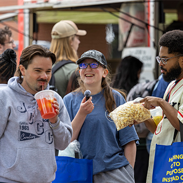 Students enjoying free popcorn during the Cav Craze celebration which takes place each May