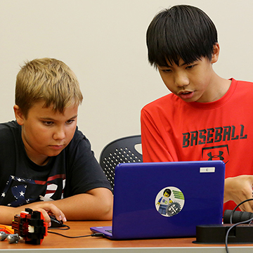 Two boys enjoy a summer enrichment program at JCCC.