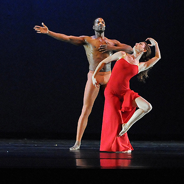 A man and woman ballet dancer strike a dramatic pose.