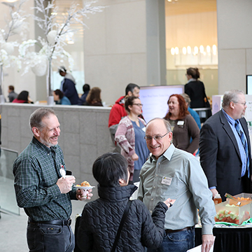 people mingling in Regnier atrium