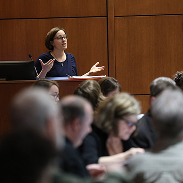 Presenter at podium during an event at the Regnier Center