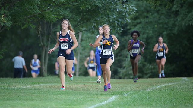 Runners competing on the cross country course