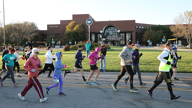 Marathon runners on a JCCC road