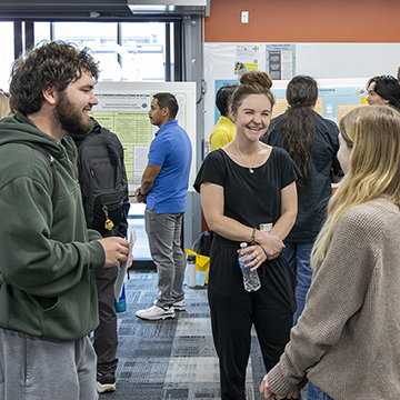 students presenting their research at the 2026 STEM Poster Symposium at JCCC