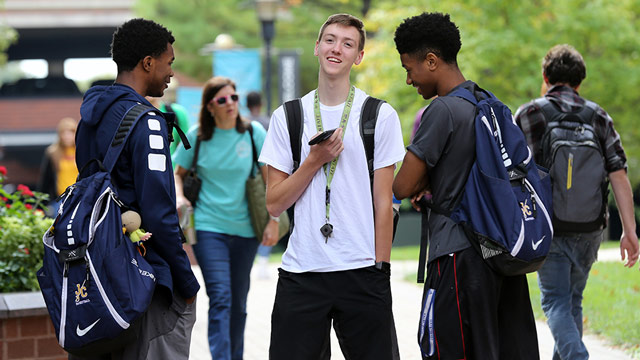 Two students share a laugh on the JCCC campus.
