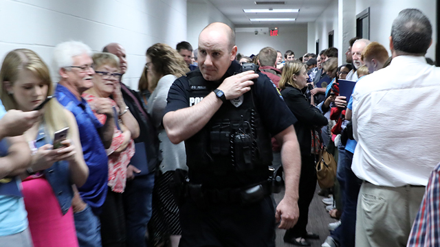 JCCC Police Officer Seth Mullis helps with a storm sheltering during a weather event on campus.