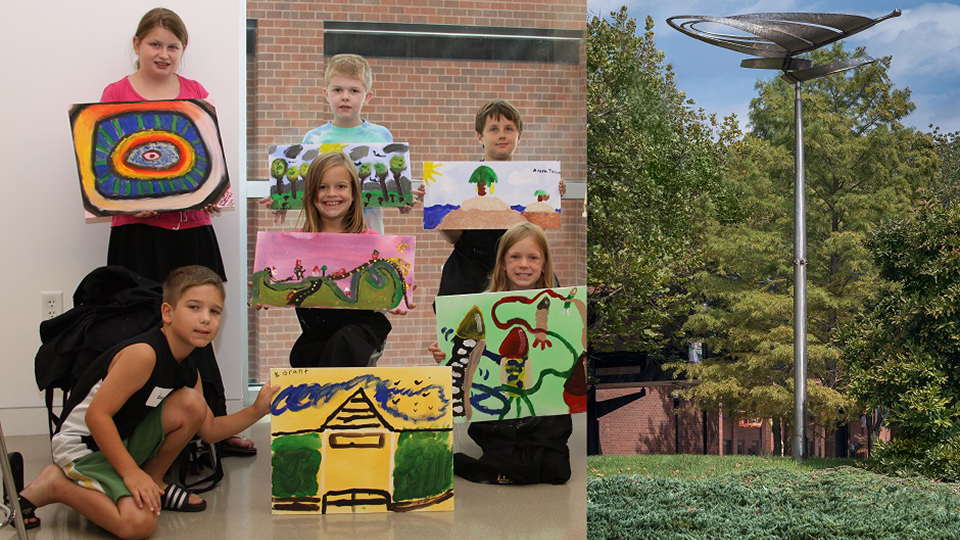 8 children display works of art they created during a youth summer art class.
